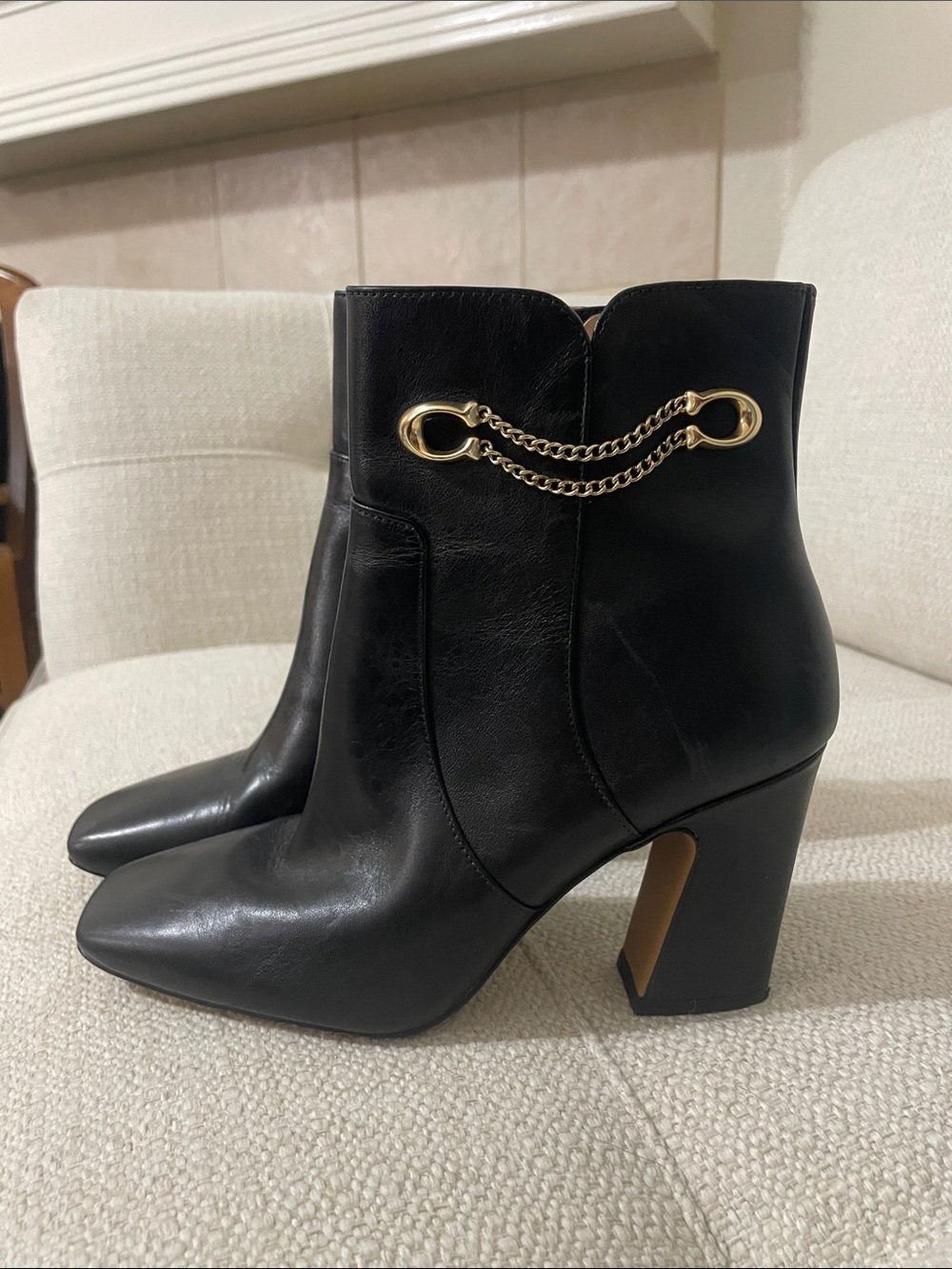Coach Black Leather Ankle Boots with Gold Chain Detail